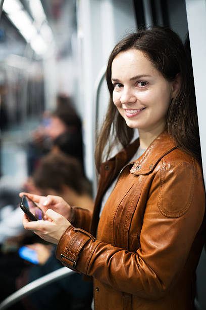 istock Woman with smartphone at subway 629441370