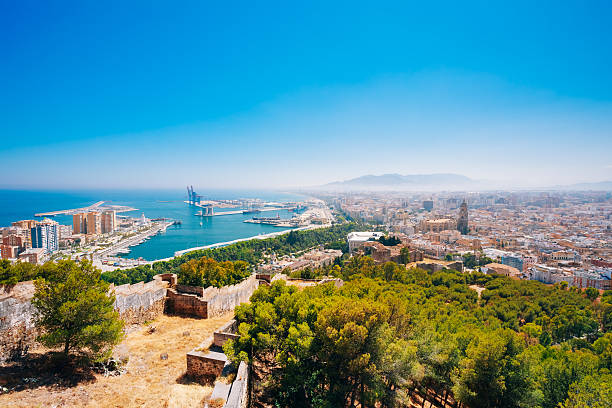 Cityscape Panoramic Aerial View Of Malaga, Spain. Panorama Cityscape Panoramic View Of Malaga, Spain. View From Old Medieval Fortress. costa del sol málaga province photos stock pictures, royalty-free photos & images