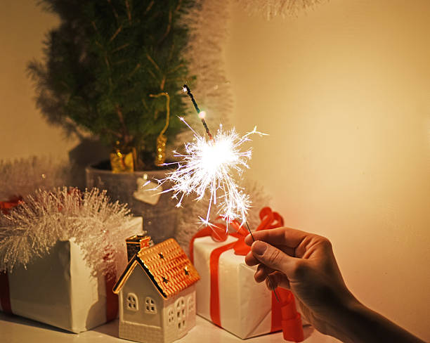istock Christmas sparklers in darkness. New Year decorations on background. 629441640