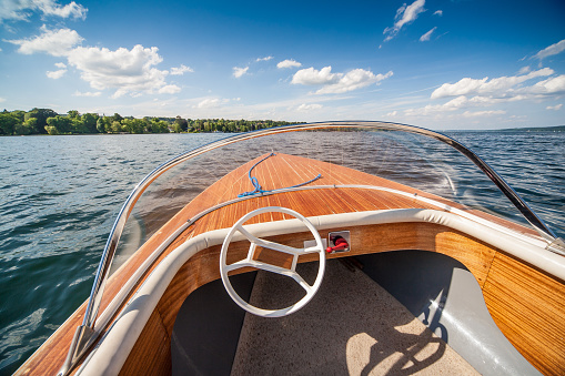Wide angle view of a classic wooden sport boat on a sunny day.