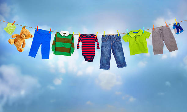 istock multicolored clothes on clothesline against blue sky 629443218