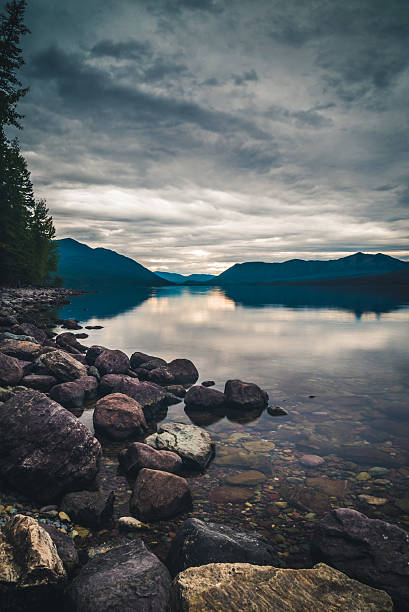 istock Lake McDonald on overcast day. Portrait orientation. 629443826