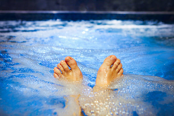 istock Person relaxing in whirlpool 629446130