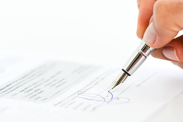 istock Sign a contract or agreement with a pen 629447372