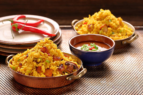 istock Chicken with basmati rice fried in stainless pan 629447478