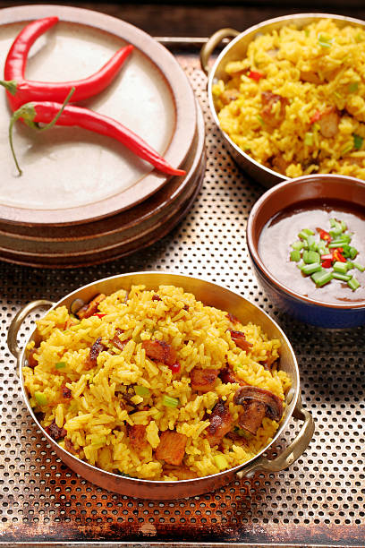 istock Chicken with basmati rice fried in stainless pan 629447580