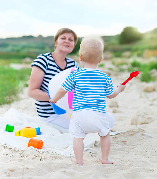 istock Happy family having fun at the beach 629448704