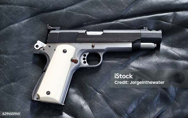 Antique 45 Caliber 1911 Pistol Stock Photo - Download Image Now - Foal - Young Animal, Gun, Handgun