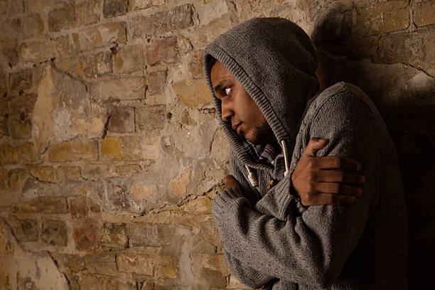 istock Drug addict posing near brick wall 629457060