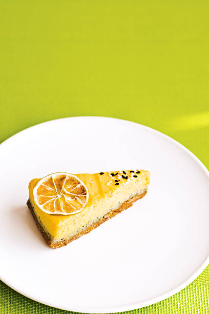 istock Healthy lemon and lime cake cut on a white plate 629457404