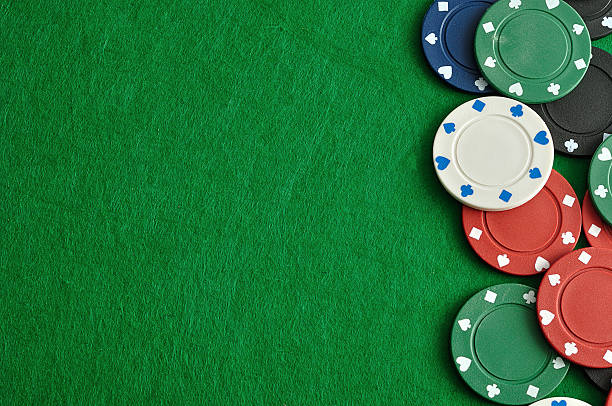 istock Poker chips forming a border with a green backgroun 629458624