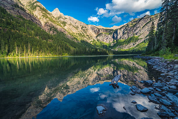 istock Avalanche Lake reflecting mountains and skies. 629459286