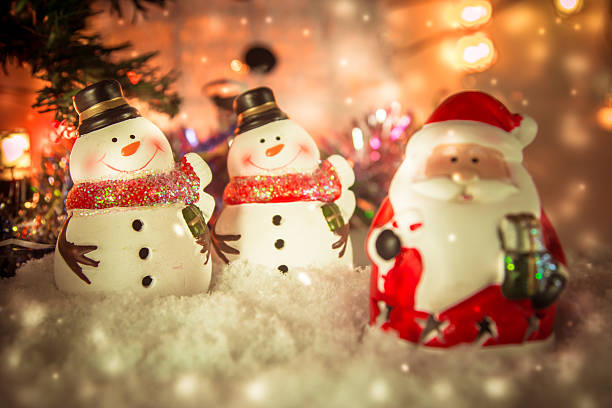 istock snowman and Santa clause in snow christmas item 629459632