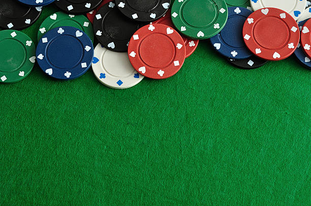 istock Poker chips forming a border with a green backgroun 629481402