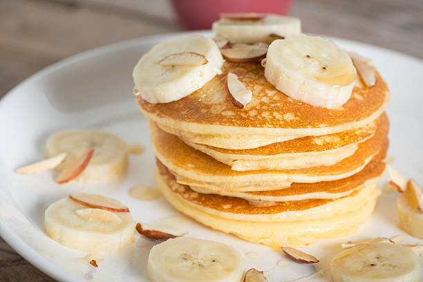 istock Pancakes with bananas almond and caramel sauce. selective focus. 629494458