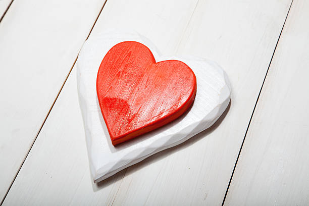 istock Heart on a white wooden background 629494582
