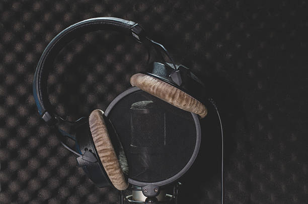 istock Headphone and microphone recording studio on a black background. 629495864