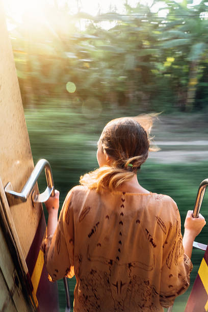 istock Woman standing in the train door 629496294