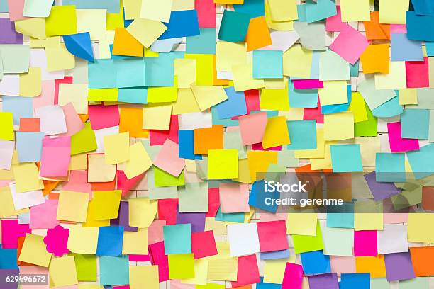 Wall Covered With Adhesive Note Papers Stock Photo - Download Image Now - Adhesive Note, Wall - Building Feature, Chaos