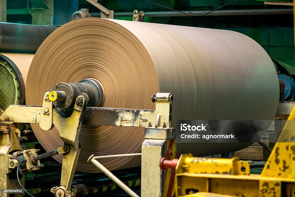 Paper mill factory Paper and pulp mill factory. Brown paper production. Spool Stock Photo