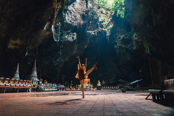 istock Woman dancing in the Buddhist temple in cave 629497440