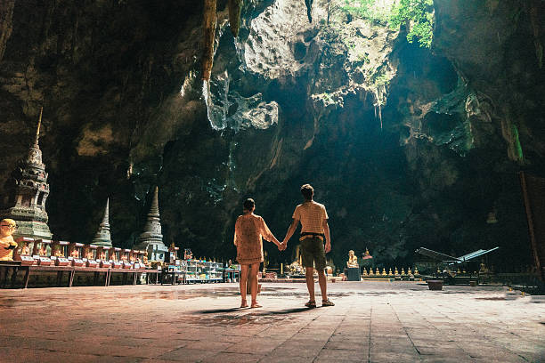 Couple in the  Buddhist temple in cave