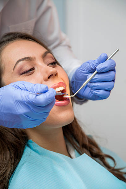 istock Female patient open her mouth during treatment 629497812