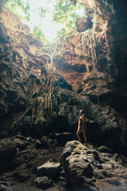 istock Woman standing in the cave 629507318