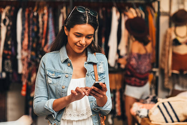 istock Sharing her shopping experience with her social network 629507966