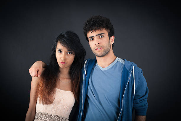 istock Beautiful couple doing different expressions in different sets of clothes: angry 629513896