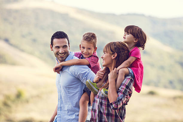 istock Happy parents having fun with their children in nature. 629528250