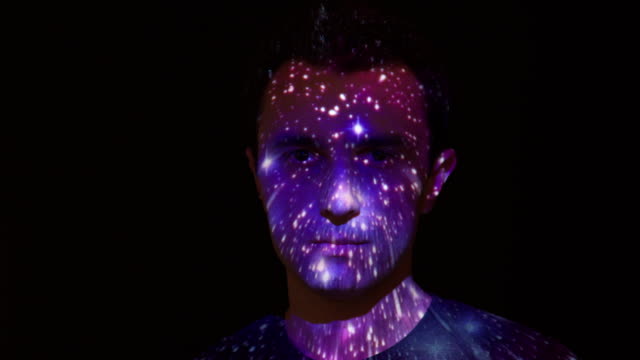 Space journey projection on man's face