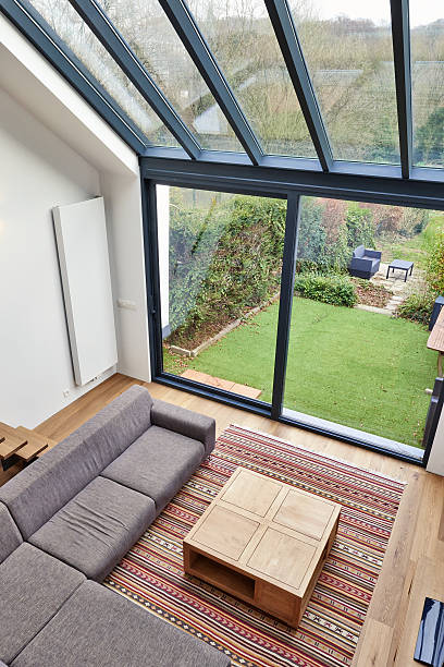 istock Modern living room with large windows 629553220
