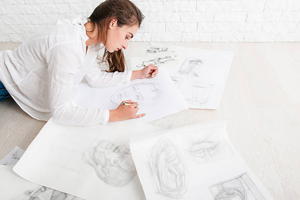 istock Successful woman artist drawing in workshop 629553676