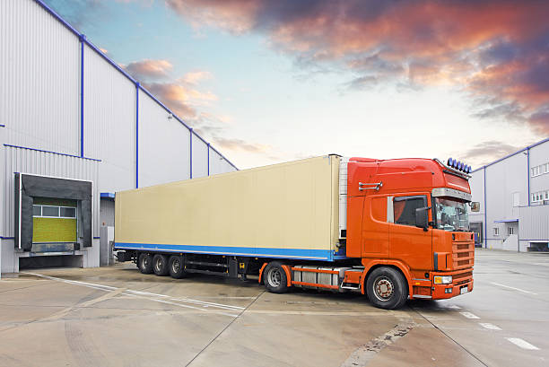 istock Truck in unloading in warehouse 629556390