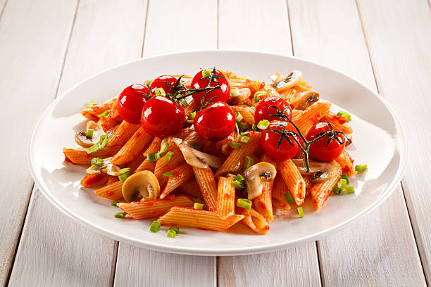 istock Penne with pesto sauce and vegetables 629557638