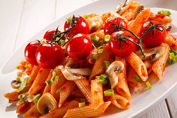 istock Penne with pesto sauce and vegetables 629557792