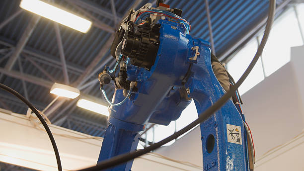 istock Automated robotic machine - mechanical arm for industrial welding 629564834