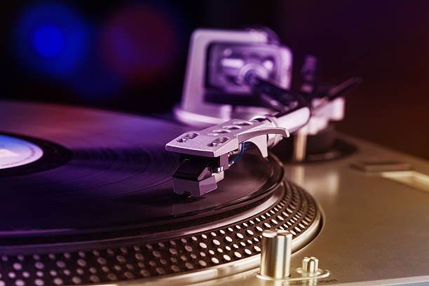 istock Close-up of a DJ turntable with vinyl record 629565306