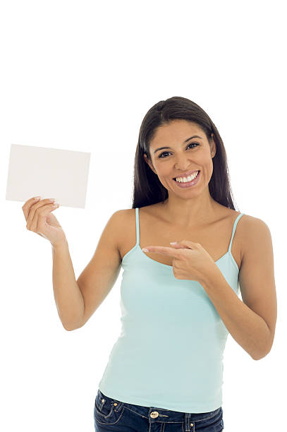 istock attractive happy hispanic woman holding blank billboard with copy space 629566702