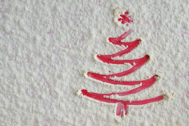istock Red Christmas tree on flour background. White flour looks like 629566722