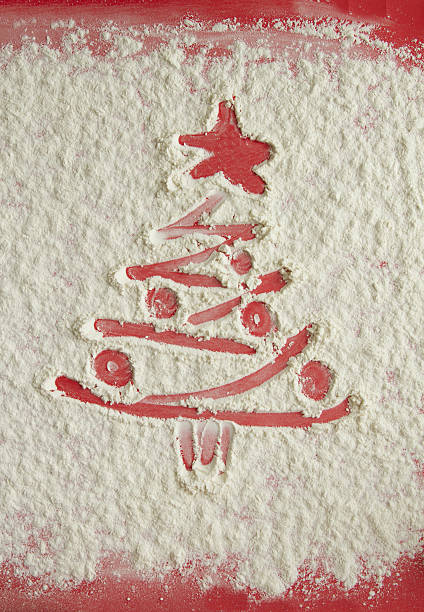 istock Red Christmas tree on flour background. White flour looks like 629567148