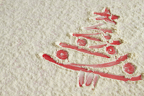 istock Red Christmas tree on flour background. White flour looks like 629567248