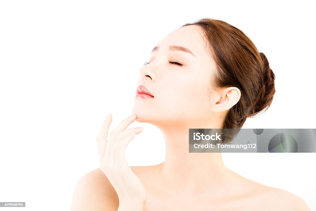 Beautiful face of young  woman with clean fresh skin Beauty Treatment Stock Photo