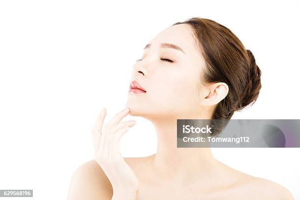 Beautiful Face Of Young Woman With Clean Fresh Skin Stock Photo - Download Image Now