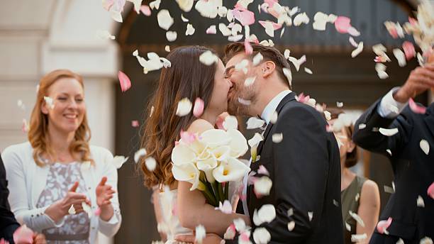 istock Bride and groom kissing 629569008