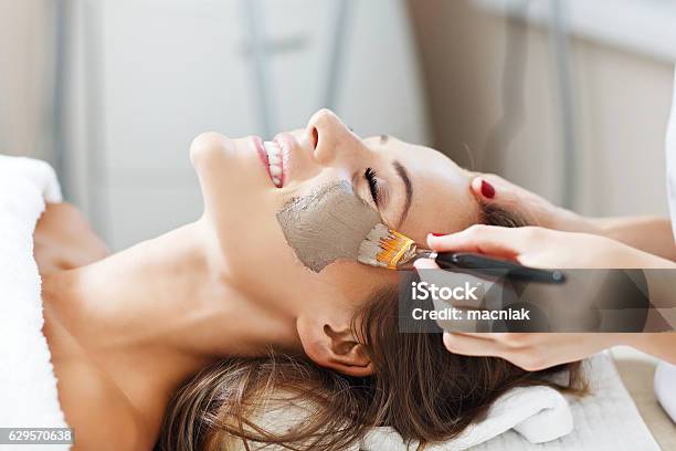 Woman With Facial Mask In Beauty Salon Stock Photo - Download Image Now - Facial Mask - Beauty Product, Human Face, Women