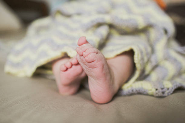 istock adorable newborn baby feet 629572428