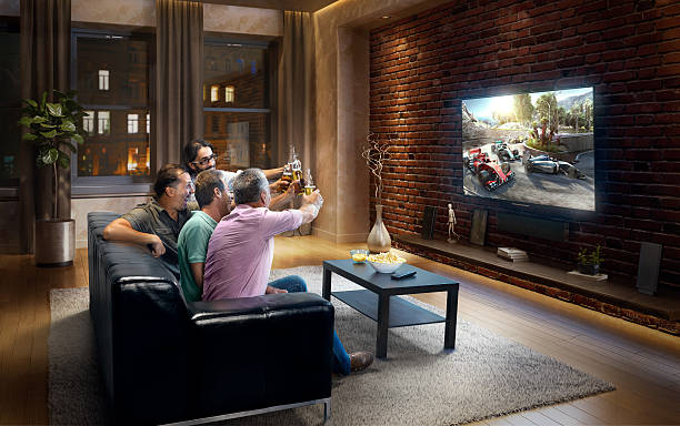 istock Adults watching Car sprint at home 629581232