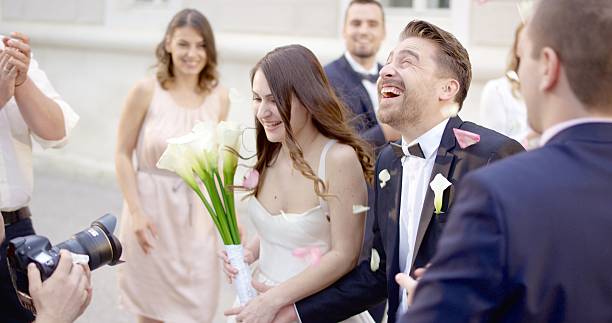 istock Groom and bride leaving from church 629584328